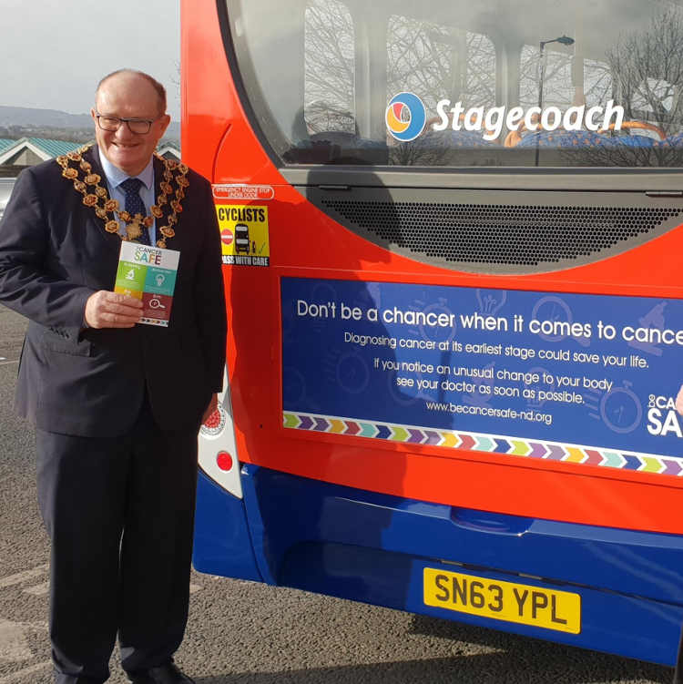 mayor and mayoress back of bus