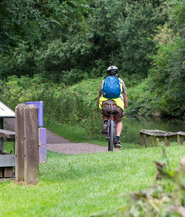 Man cycling away on a bike