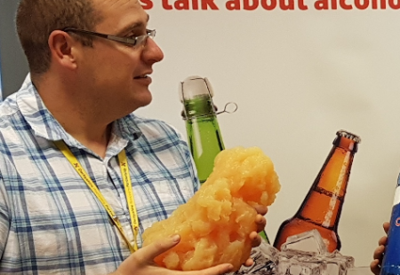 Male holding a replica of a Kidney affect by substance misuse