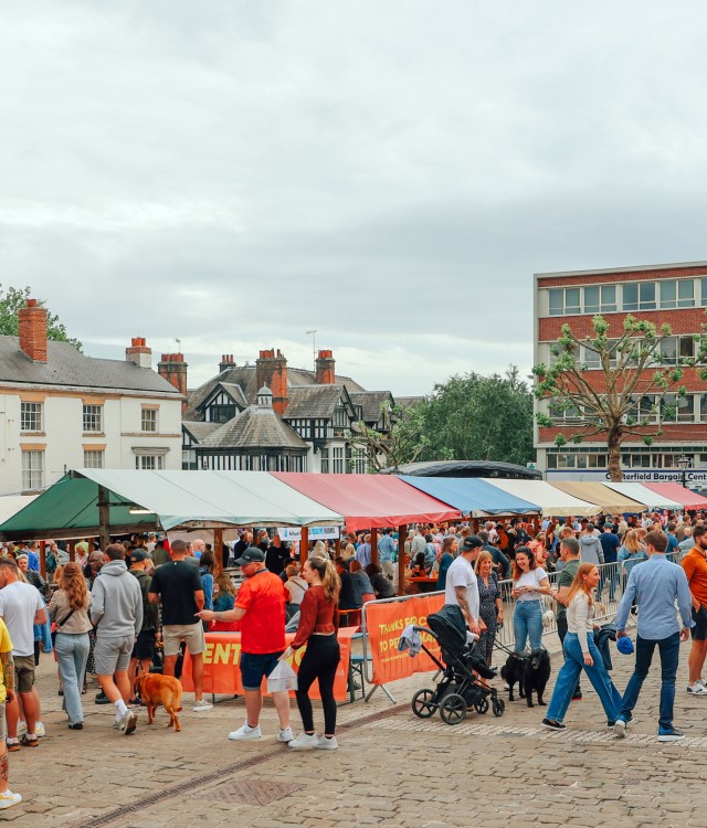Crowds enjoying food at colourful market in Chesterfield