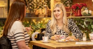 Friends enjoying tea in china cups at a table at Vintage Tea Rooms, Chesterfield
