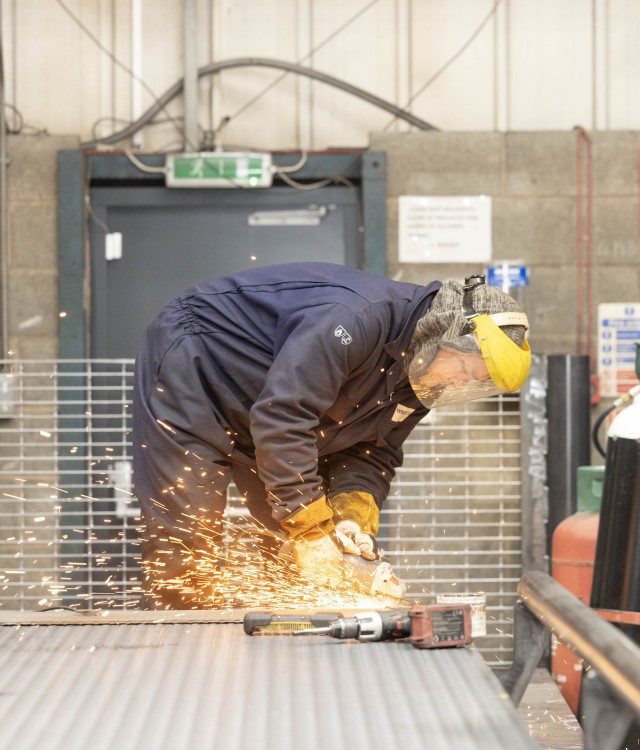 Man working on industrial weighbridge at Weightron