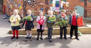 Learning in Chesterfield - Six pupils holding their plants in the garden at Heath Primary School