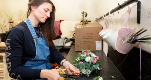 Florist arranging flowers at Hoods Florist on Whittington Moor