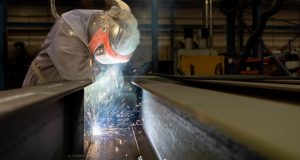 Engineer with protective gear at work at Weightron