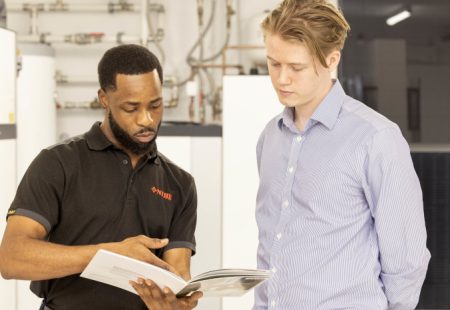 Two individuals conducting training at a local business
