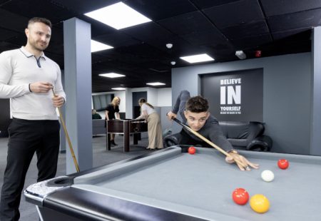 Employees at Superior Wellness playing games in wellbeing facilities at the office